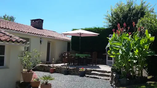 Photo of rear of Le Petit Bouleau showing private terrace - holiday rentals